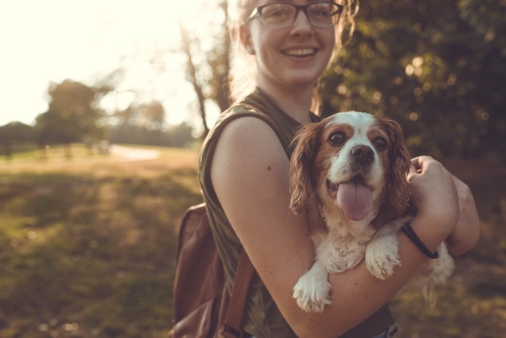 woman holding dog | Dog Friendly San Antonio