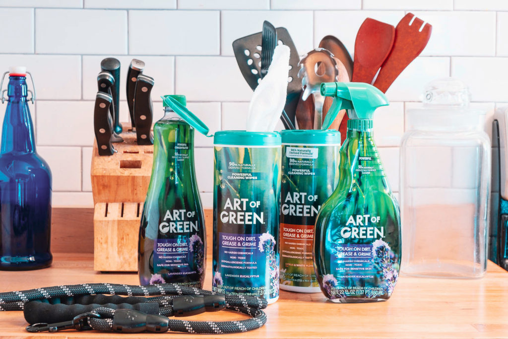Art of Green cleaning products on kitchen counter with dog leash