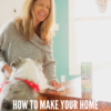 woman using art of green cleaning wipes to clean with dog jumping up at table and making her laugh