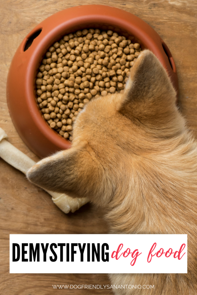 dog looking down at food bowl, caption reads "demystifying dog food"