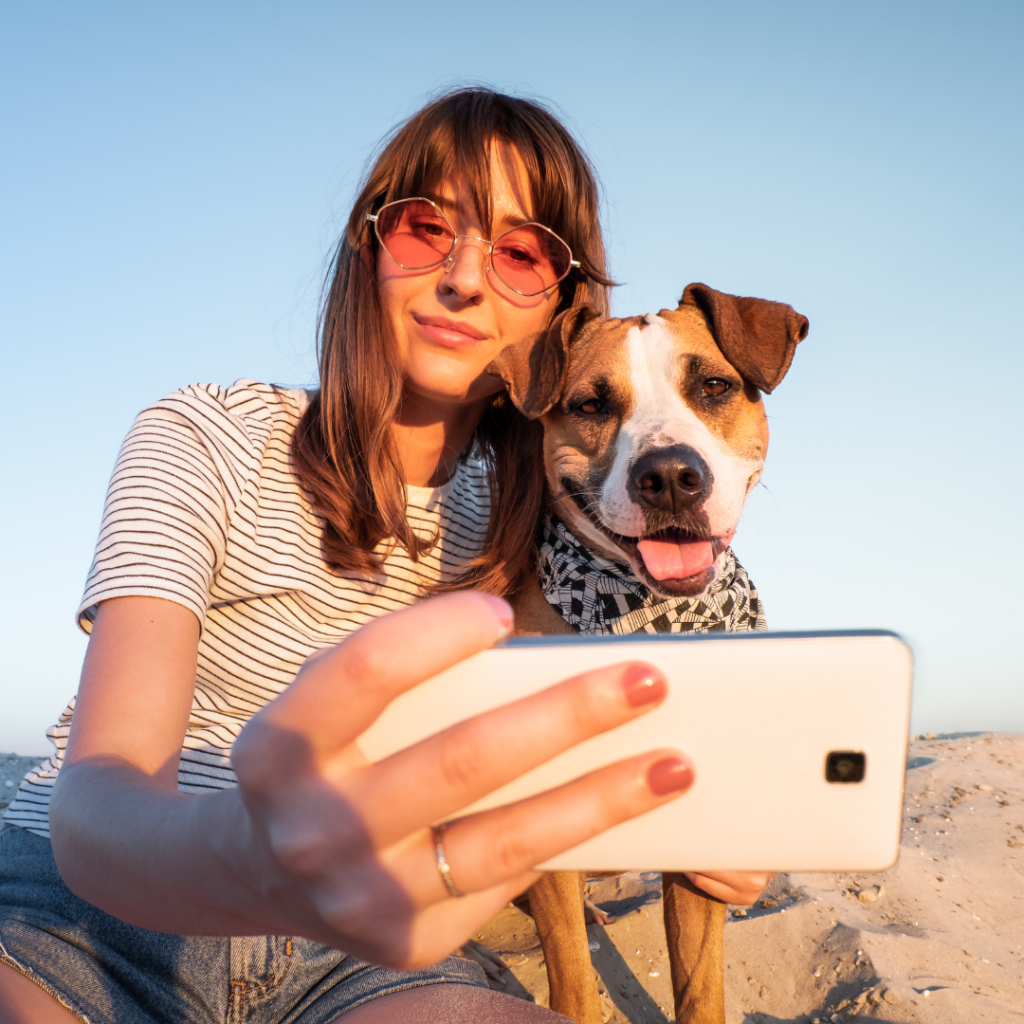 woman taking selfie with dog